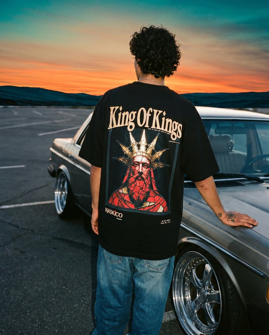 Model wearing NaskiCo King Of Kings tee