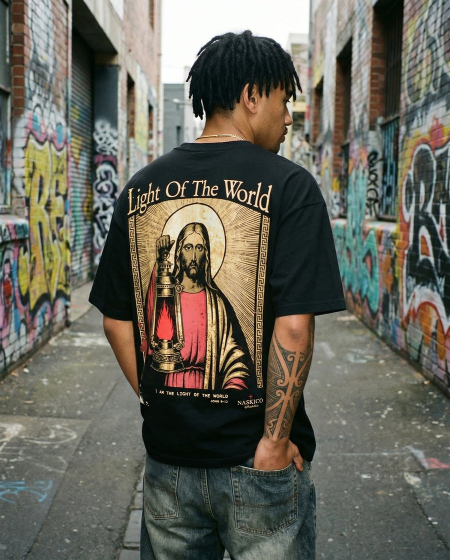 Model wearing the NaskiCo Light Of The World tee