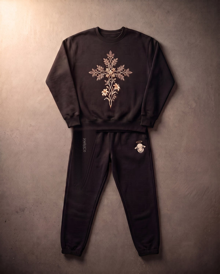 Consider The Lilies set laid flat, vine cross on the crewneck, vine letterform and halo sheep on the joggers