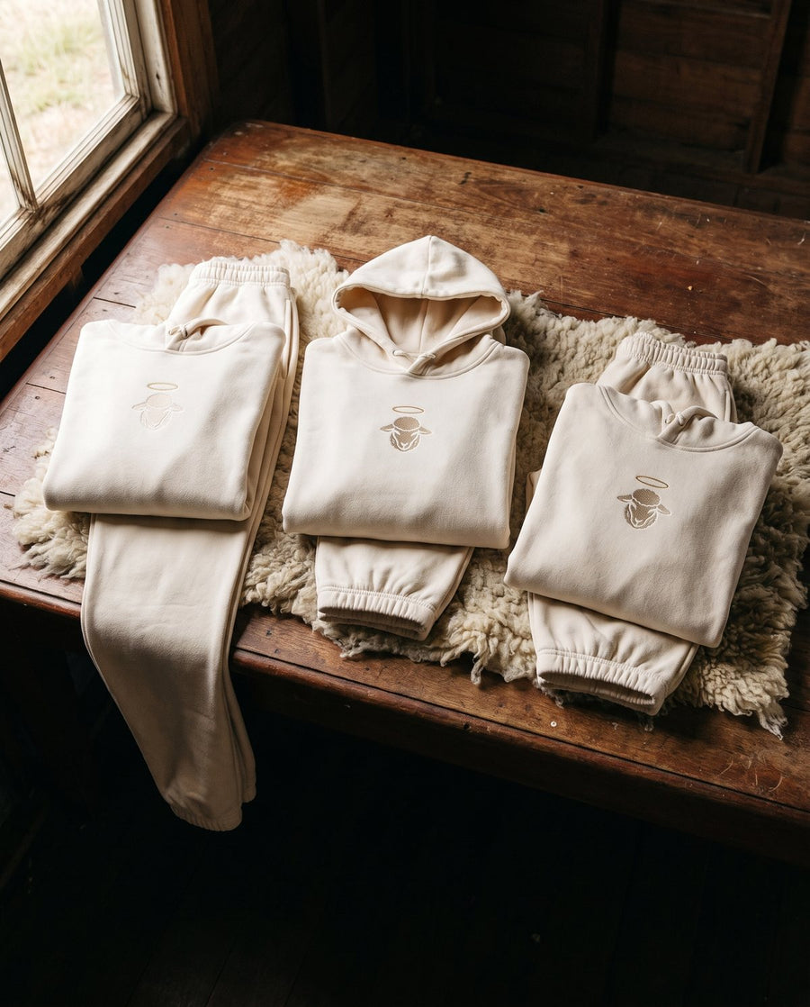 Three folded Skyfold cream sets on a shearing-shed classing table