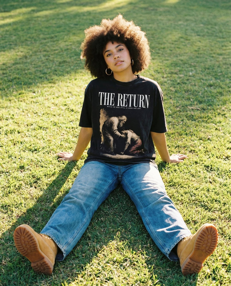 Aussie model wearing NaskiCo The Return Christian streetwear tee