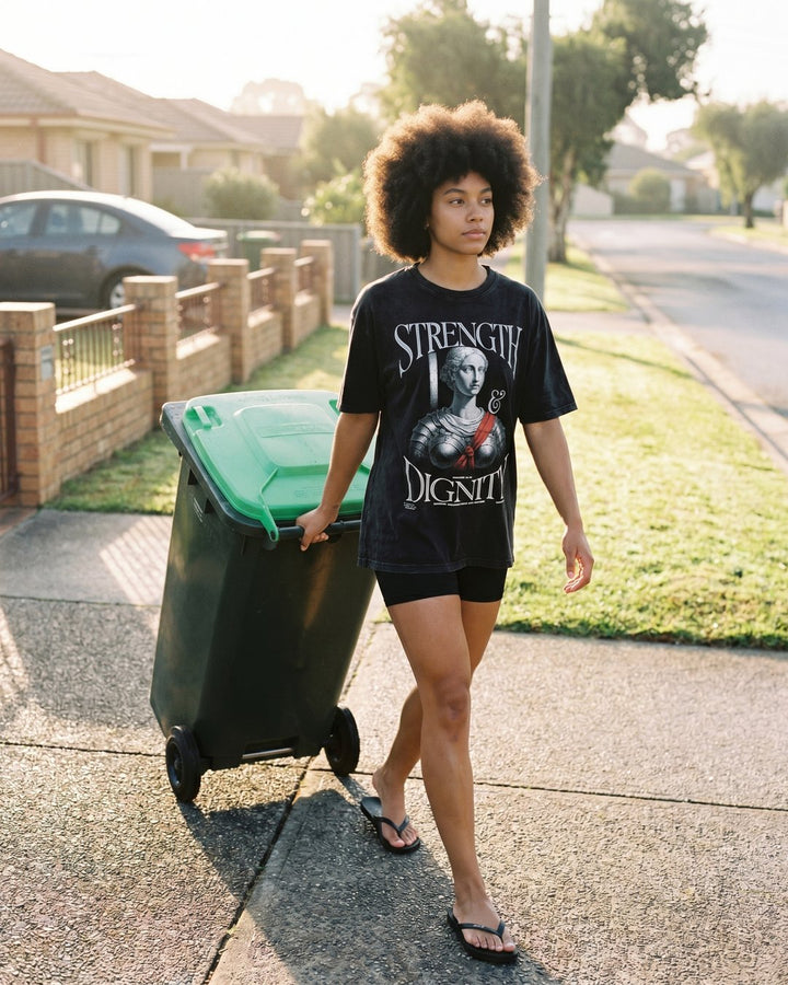 Model in the NaskiCo Strength & Dignity tee and thongs taking out the bins, Proverbs 31:25